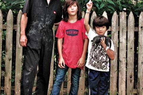 The Jerusalem artichoke flowers hadn’t reached their peak when, from left, Hiroyuki, Cosmo, and Rock Hamada posed for this photo.