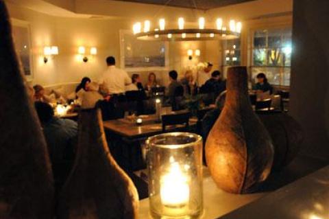 The atmosphere at Tutto il Giorno is as enticing as the food, with low, soft lighting, a muted gray palette, and comfortable banquettes.