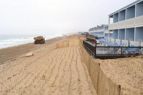 Beach grass planted in straight rows atop a buried sandbag wall on Montauk’s downtown beach will be fenced off and pedestrian access to the shore allowed only over wooden walkways at four different oceanfront spots.