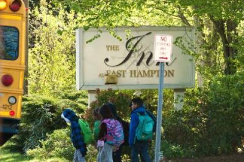 Children boarded a school bus near the Inn at East Hampton.