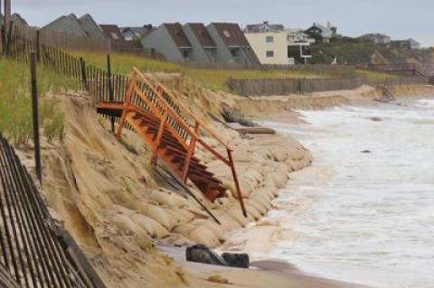 Repairs will be made by the Army Corps after ocean waves last weekend washed away sand, exposing the sandbag seawall installed by the federal agency along the downtown Montauk beach, and leaving a stairway over the dune precariously perched above the surf.