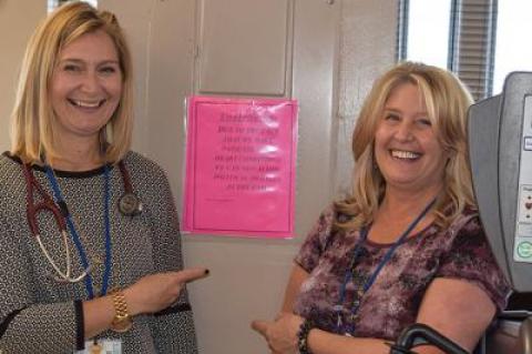 Jessica R. Swiatocha, left, the manager of cardiopulmonary rehabilitation at Southampton Hospital, and Debra Jensen, a physical therapy assistant, agreed that the sign barring patients from heated political debate was necessary.