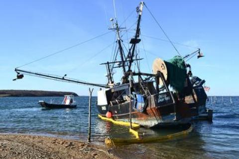 On Monday a boom was placed around the Miss Scarlett to contain any potential oil leaks; the oil was pumped out by the end of the day Tuesday.