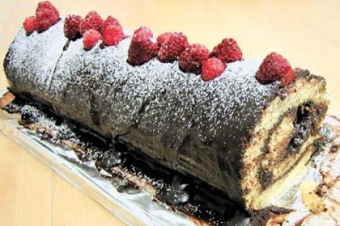 A buche de Noel or Yule log is a French dessert made of sponge cake and buttercream rolled and decorated to look like a log.