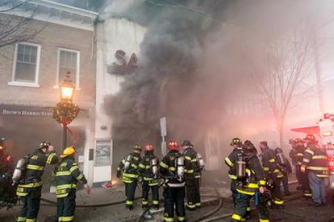 Smoke billowed from the doors of the Sag Harbor Cinema early Friday morning as firefighters worked to control a blaze that damaged or destroyed six buildings.