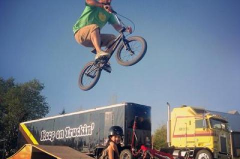 Jeff Mayer caught air at the Hayground School while his son, Luca, looked on. Their 1981 Kenworth semi and its creative-space trailer, is in the background. Jeff Mayer caught air at the Hayground School while his son, Luca, looked on. Their 1981 Kenworth semi and its creative-space trailer, is in the background.