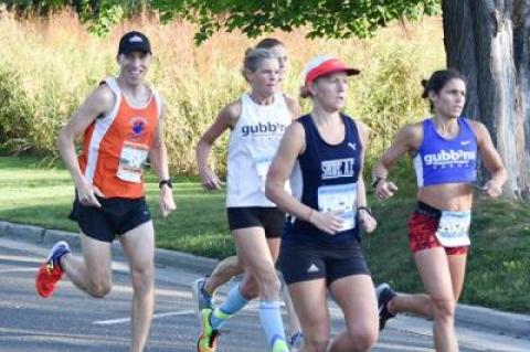 Barbara Gubbins (in the white singlet) was to finish third over all among the women, even though she’s 57.
