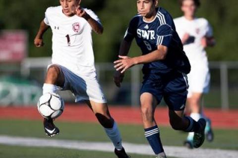 Marco Gutama (number 1) scored two goals for East Hampton’s 3-1 win in the rain here over Miller Place on Sept. 19.