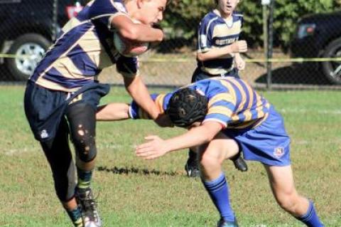 Kevin Bunce Jr., an East Hampton High School freshman, fended off a tackler in last weekend’s jayvee 7s tournament in Pelham, N.Y.