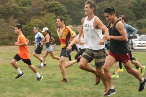 From the right, Omar Leon, Paul Hamilton, Chris Daily (the eventual winner), Beth Feit, Joe Amato, and Graeme Olsen (in the lead) sprinted across Ed Ecker County Park’s meadow at the start of Sunday’s Serpent’s Back Duathlon.