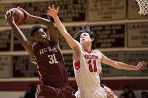 Bladimir Rodriguez Garces, coming down with a rebound above, beyond the outstretched arm of Pierson’s Emmett Shaughnessy in the Kendall Madison Tip-Off tourney’s championship game, has been working on his inside moves, as has the Bonackers’ 6-foot-8-inch center, Chris Stoecker.