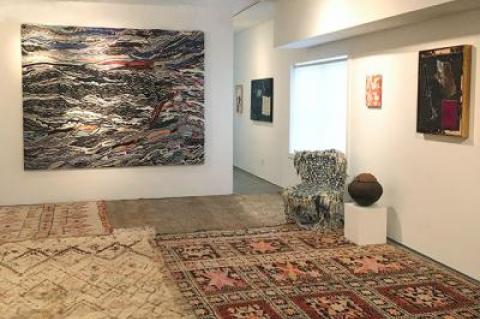 Moroccan rugs and, from left, Jayson Musson’s “Mass Shadow Generator,” a South African Zulu pot, Hank Willis Thomas’s “D Block,” and Sterling Ruby’s “D.C.” at the Rental Gallery