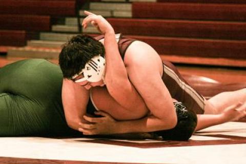 Albert Darchiev, shown pinning his Harborfields opponent above, preserved East Hampton’s 42-39 win at West Babylon by keeping his match close at 285.