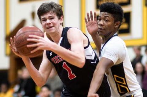 Elijah White, guarding Pierson’s Tom Brooks above, wound up with a game-high 27 points in the 63-61 loss. The Bees would probably have won had they not gone 2-for-8 from the foul line in the final 1:19.