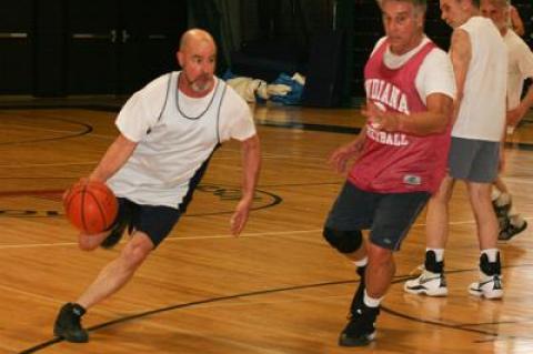 Rich Hand, driving with the ball, was effectively resurrected a few years ago by Doc Katz, far right, Claude Beudert, near right, and Charlie Bateman.