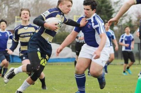 Kevin Bunce Jr., an East Hampton High School freshman, carrying the ball above, and his Rugby Academy teammates are said by Kevin’s father to be well schooled in passing, handling the ball, and tackling.