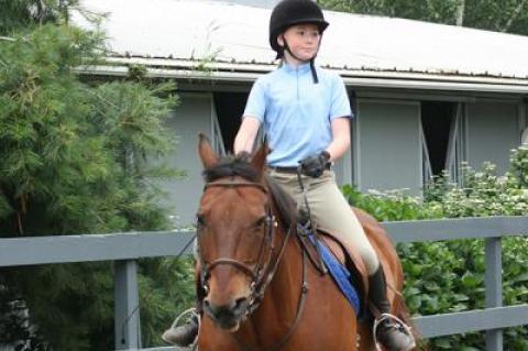Olivia Walsh, 11, with Gator above, has benefited greatly from her scholarship.
