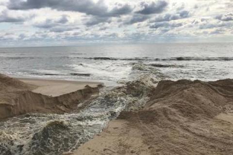Georgica Pond was opened to the Atlantic Ocean on Monday, flushing it of toxins and increasing salinity.