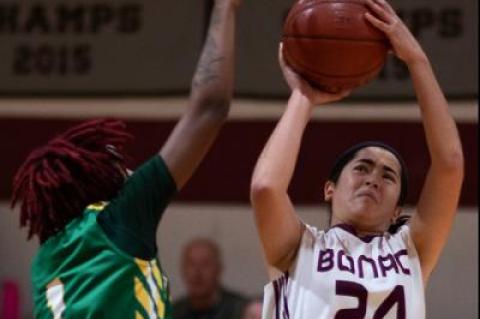 Emma Silvera (24), guarded above by Wyandanch’s Jalea Ervin, came close to making it a 1-point game in the final minute, but her 3-point attempt rolled off the rim.