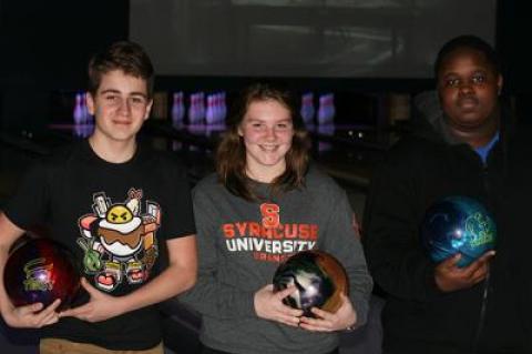 Samantha Schurr, a senior, is the team’s number-one; Matt Rosario, left, and Sy Webb, right, are numbers two and three.