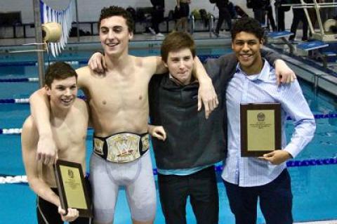 The four captains of the East Hampton boys swimming team, Ryan Duryea, Ethan McCormac, Ryan Bahel, and Jordan Uribe, posed afterward with the team’s plaques.
