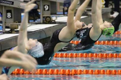 Julia Brierley, arching at the start of the 100-yard backstroke above, placed second in that event and second in the 100 breaststroke. She will compete in the Y.M.C.A. national meet in Greensboro, N.C., next month.