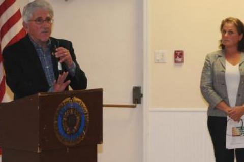 Following her presentation Monday on the East Hampton Housing Authority's proposed affordable housing complex in Amagansett, Katy Casey, the group's executive director looked on as Town Supervisor Larry Cantwell addressed the large crowd gathered in the American Legion Hall.