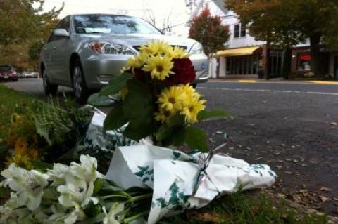 Flowers left alongside Main Street in Amagansett, where John Judge, 61, was stuck and killed in a hit-and-run accident Tuesday night.