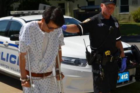 Jungsik Lee used crutches to walk into East Hampton Town Justice Court where he faces a driving while intoxicated charge on Tuesday.