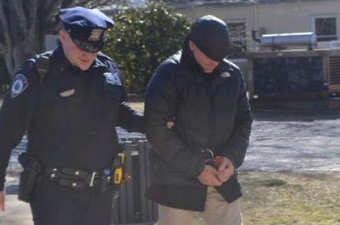 Jefferson Davis Eames was led into East Hampton Town Justice Court on Thursday afternoon for his arraignment on a felony charge of grand larceny.