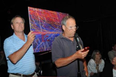 Barry Raebeck, left, and Tom McNiven displayed a image showing flight paths over the East Hampton Airport. Barry Raebeck, left, and Tom McNiven displayed a image showing flight paths over the East Hampton Airport.