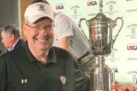 Jon Diat took advantage of a golden opportunity Monday to pose with the U.S. Open’s silver cup.