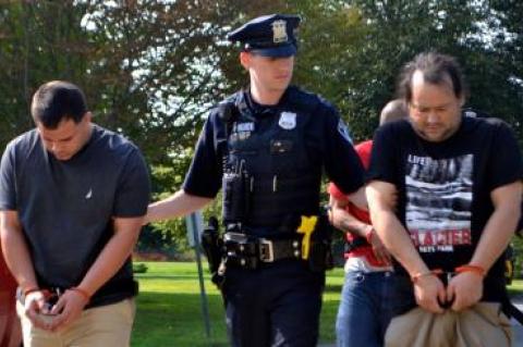 Jonathan Hernandez-Ruiz, left, and Elvin Silva-Ruiz, right, were led into East Hampton Town Justice Court Saturday to face felony cocaine possession charges.