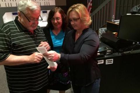 In East Hampton, the ballot counting began just after 8 p.m. From left, John Bouvier and Laura Oliverio, both election inspectors, reviewed an election receipt with Kerri Stevens, the district clerk. In East Hampton, the ballot counting began just after 8 p.m. From left, John Bouvier and Laura Oliverio, both election inspectors, reviewed an election receipt with Kerri Stevens, the district clerk.