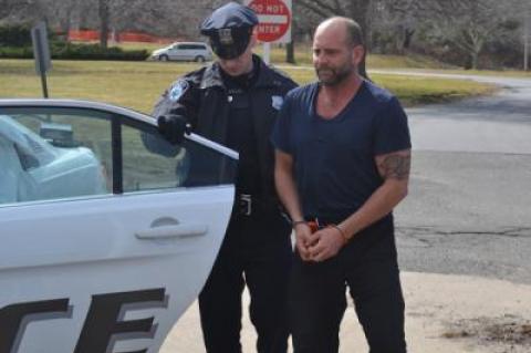 Jefferson Davis Eames was led to his arraignment at East Hampton Town Justice Court Friday.