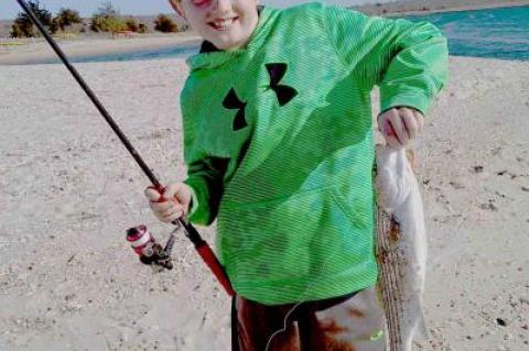 Canyon Ross hooked his first striped bass of the season at Louse Point in Springs.
