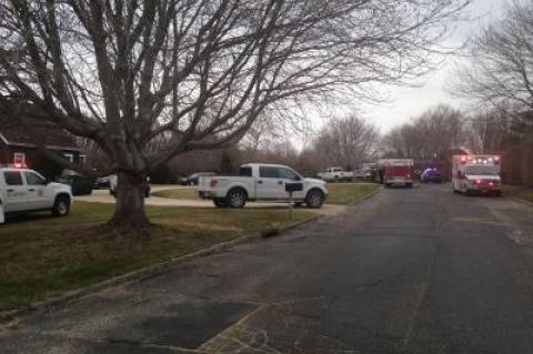 The scene outside the construction site at 45 Summerfield Lane in Water Mill on Tuesday afternoon while firefighters worked to free a man trapped by dirt that collapsed on him.