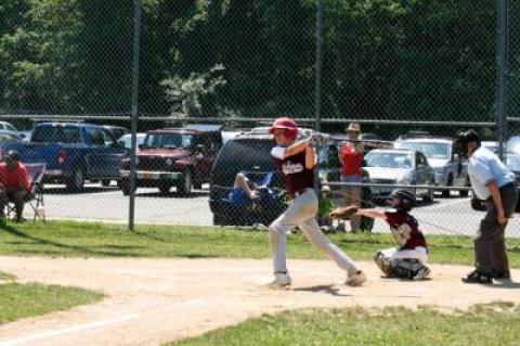 Jack Dickinson, at bat above, struck out 14 in the East Hampton 11-12 traveling all-star baseball team’s 9-0 shutout of the North Shore Americans.