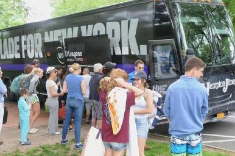 People poured out of the Hampton Jitney that arrived in front of the Huntting Inn on Main Street in East Hampton Friday, at the start of Memorial Day weekend.