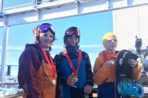 Noah Avallone, middle, after winning a Glacier 3000 slopestyle race in Switzerland in November.
