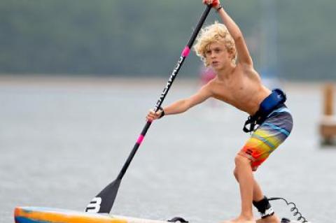 Jameson Roeber, 8, of Port Jefferson, won Paddle for Pink’s quarter-mile kids race “by a mile,” according to one observer. Below, Helen Gifford and Jennifer Ford were the tandem winners. “Teamwork and camaraderie” saw them through, Ford said.