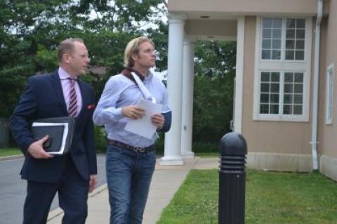 Kyle Rosko, his left arm in a sling, left East Hampton Town Justice Court with his attorney, Colin Astarita, after posting $2,500 bail.