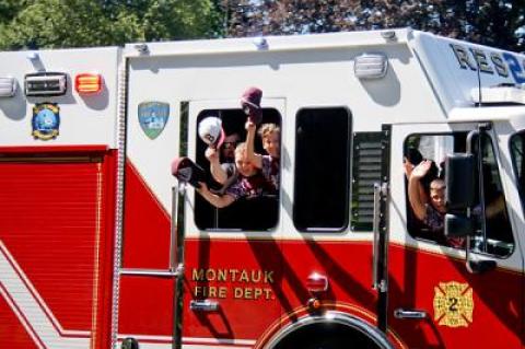 Winning a District 36 championship earned East Hampton’s 9-to-10-year-old Little League baseball team fire truck rides on their return home Saturday