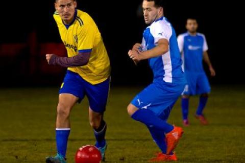 Donald Martinez, at left, scored two goals in the 7-on-7 men’s soccer final for F.C. Tuxpan Monday, while Nick Escalante of Tortorella Pools, at right, also had two. Tuxpan was the winner, though, by a score of 7-2.