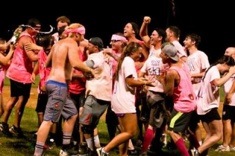 After the tournament’s final game, the losers assailed the winners with hugs, high-fives, and sprayed champagne.