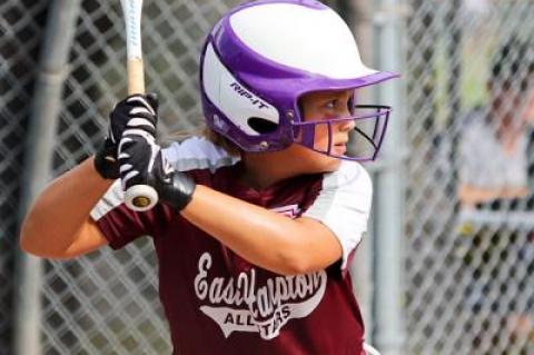 Above, Julia Kuneth awaits the pitch. Below, Mike Ruddy, the head coach, tells Gabrielle Payne to head for home.
