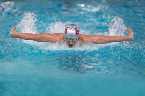 Ethan McCormac swam a state-qualifying time in the 100-yard butterfly at the Y in the meet with Ward Melville on Dec. 5.