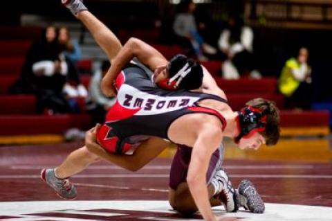 Caleb Peralta (on top), who placed third in the 126-pound division at a recent invitational tournament in Half Hollow Hills, pinned his East Islip opponent with 10 seconds to go in the first period here Friday.