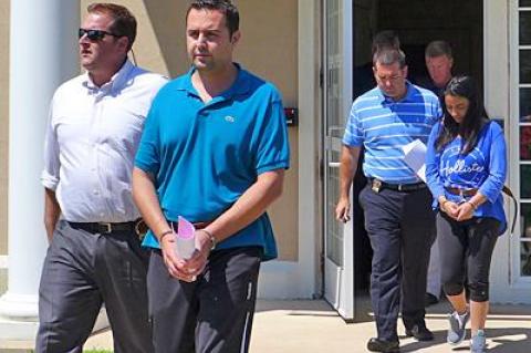 Melih and Asli Dincer were escorted from court on Friday after being arraigned on charges stemming from alleged threats made against the Jewish Center of the Hamptons. Melih and Asli Dincer were escorted from court on Friday after being arraigned on charges stemming from alleged threats made against the Jewish Center of the Hamptons.