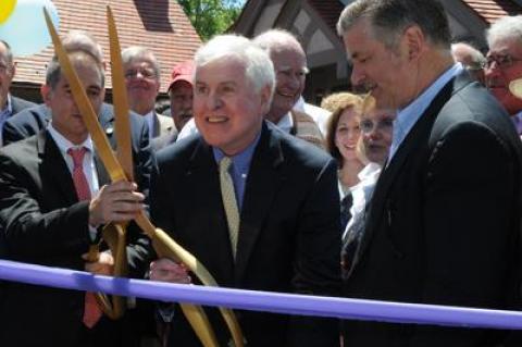 Tom Twomey, center, at the dedication of the East Hampton Library's new chidren's wing in June. Tom Twomey, center, at the dedication of the East Hampton Library's new chidren's wing in June.